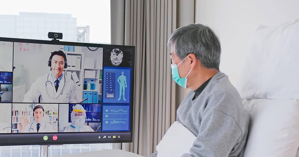 Older man on a telemedicine call with physician